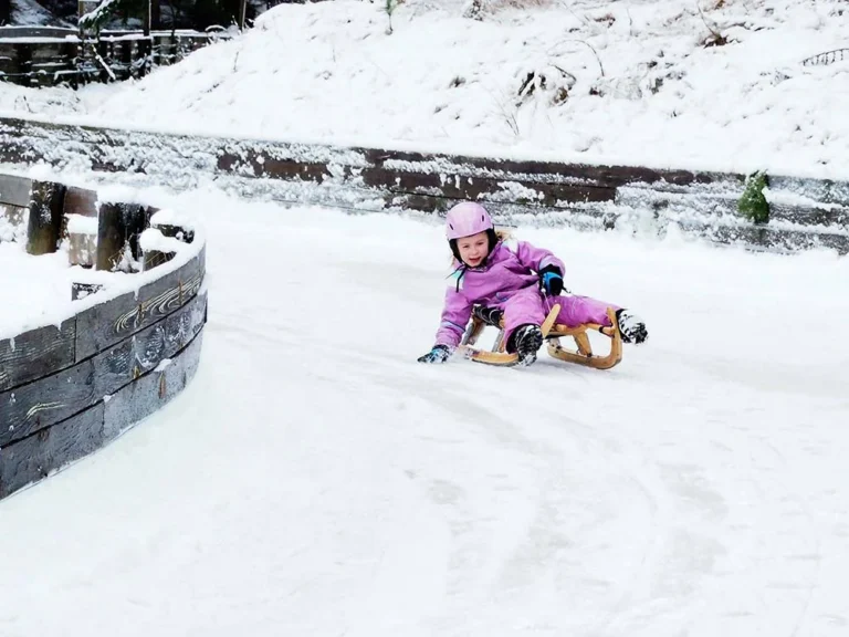 Girl Riding Luge at the Maniototo Adventure Park